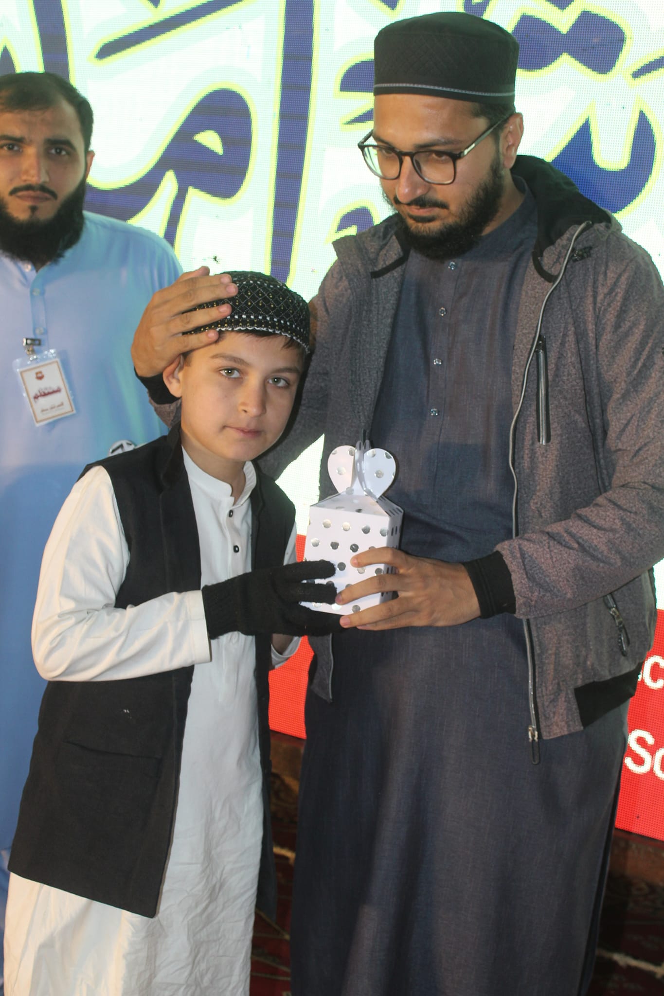 Person sitting in a modern building with a scenic view